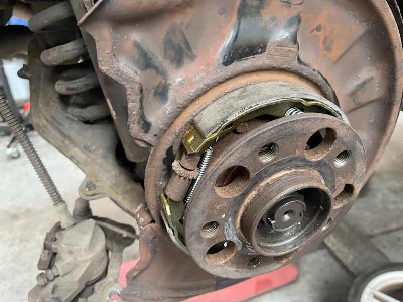 Brake drum and shoes exposed during a repair