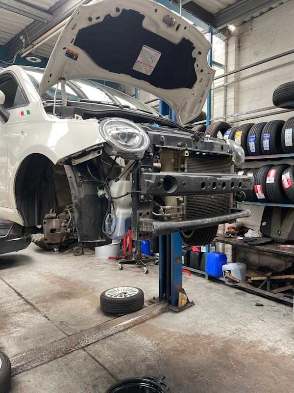 Engine removed with the car on a lift