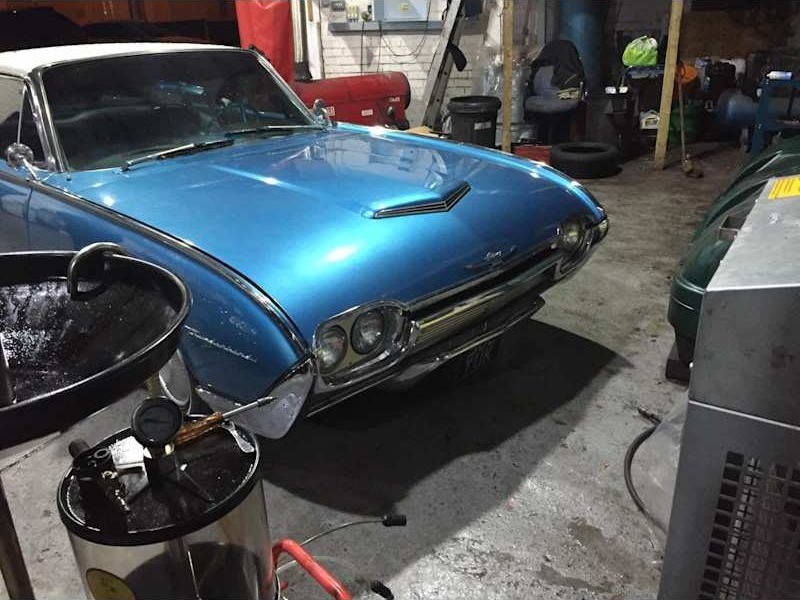 Classic car in the workshop bay