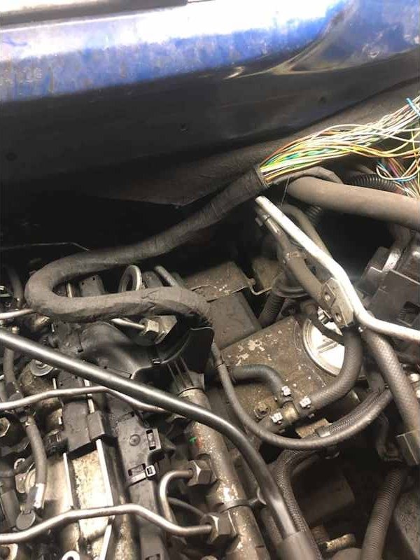 Engine bay with pipes and wiring