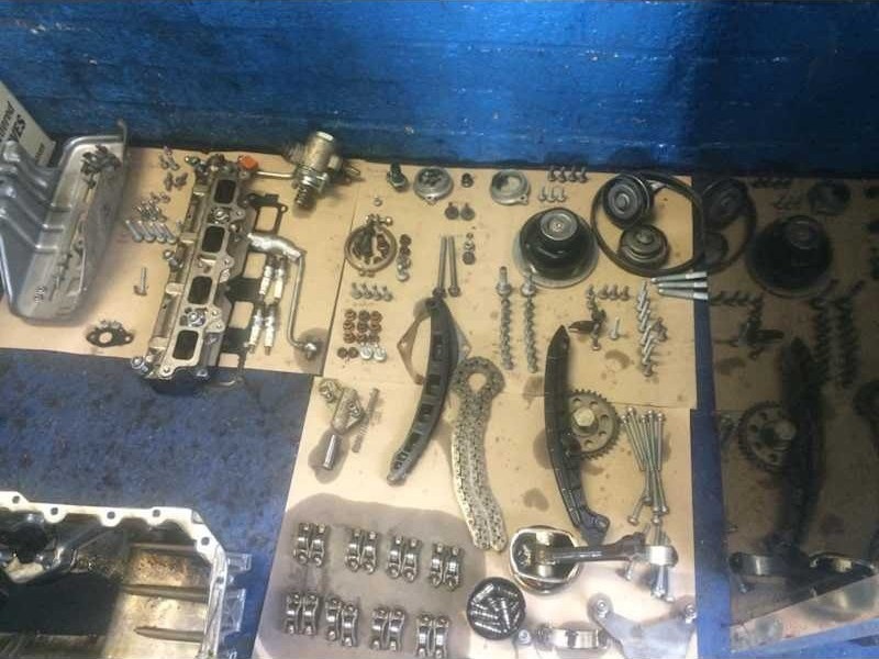 Fixings and clips laid out for reassembly