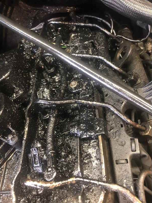 Oily engine part during a repair