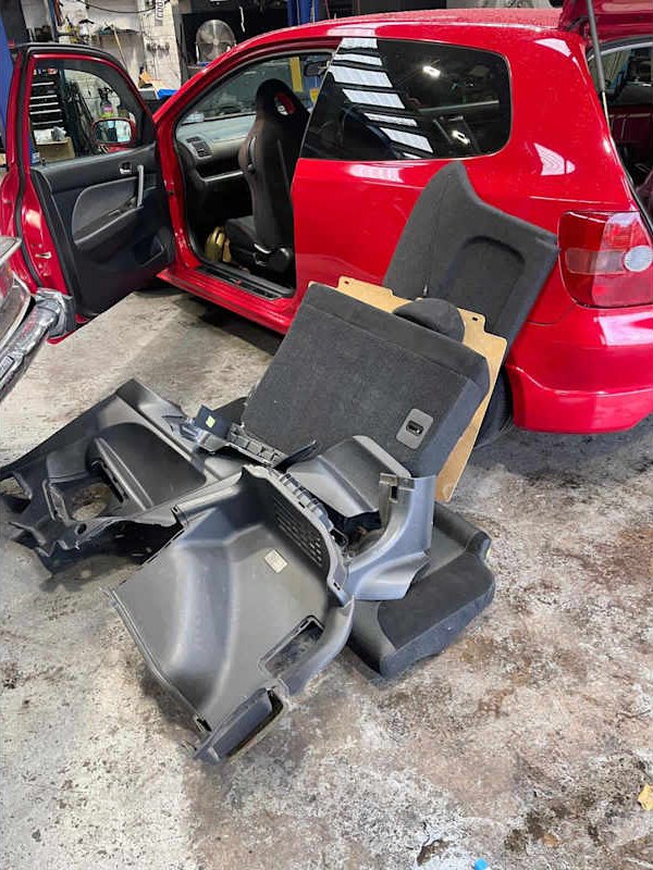 Seats removed from a car during repair