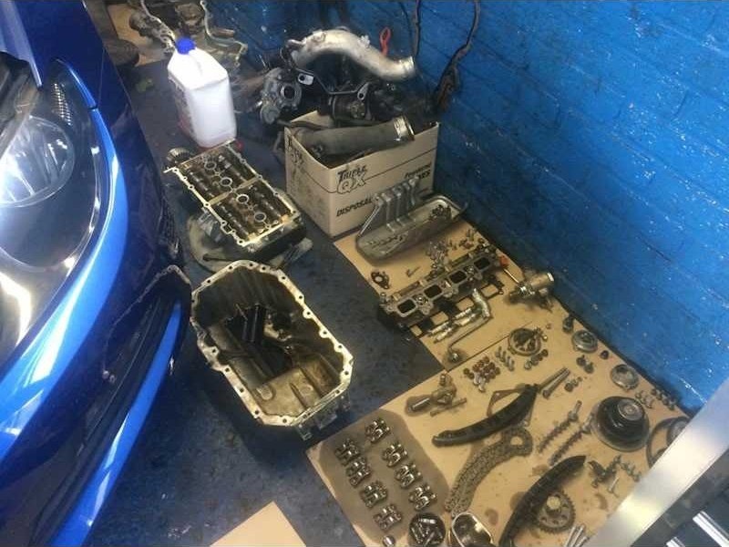 Small parts laid out during an engine repair