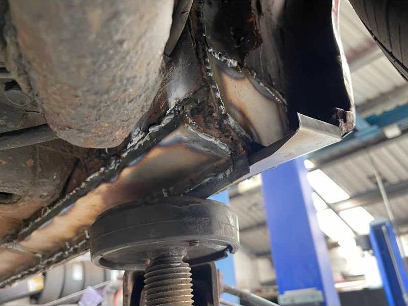 Underside of a car on the workshop lift
